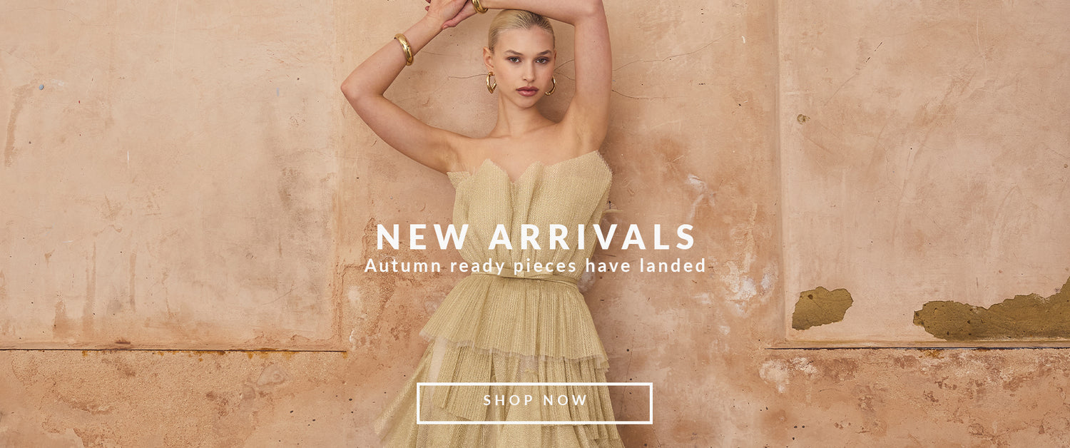 Woman in a gold shimmer strapless dress for bridesmaids and cocktail parties