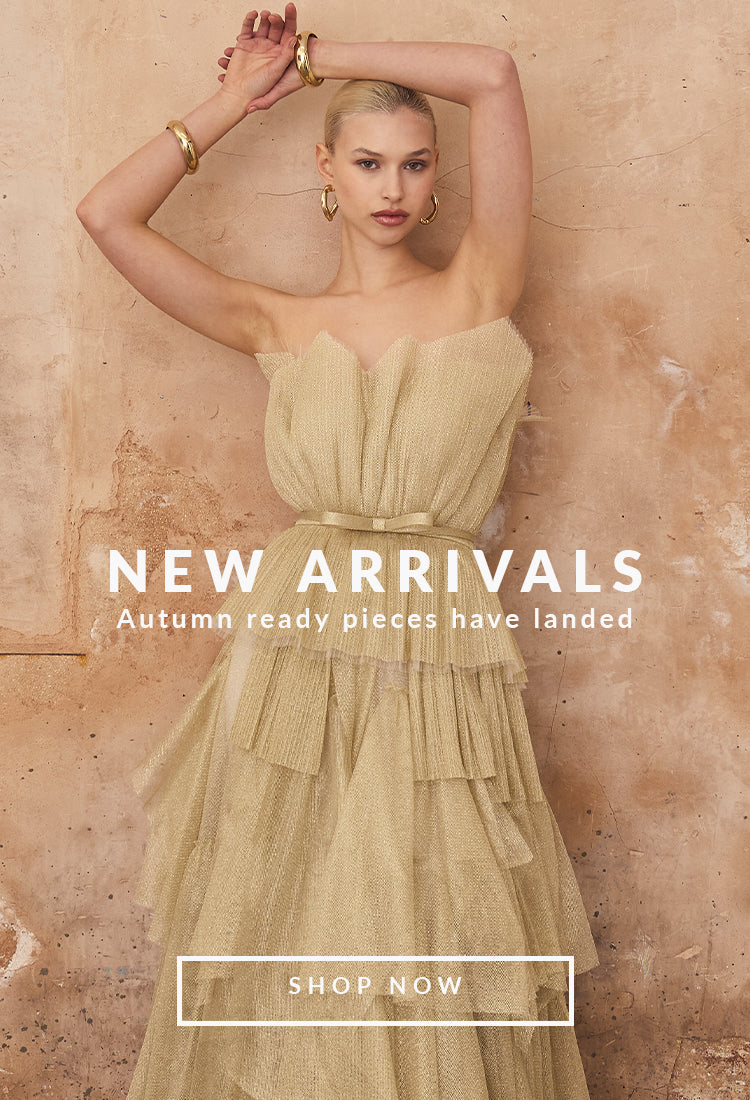 Woman in a gold shimmer bridesmaid dress against a beige background with 'New Arrivals' text. dresses for special occasions